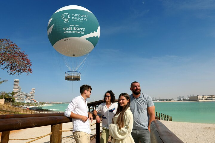 Soar above the stunning Palm Jumeirah in a tethered balloon capturing sweeping views of Dubai's skyline and its breathtaking coastal scenery. An unforgettable experience awaits!